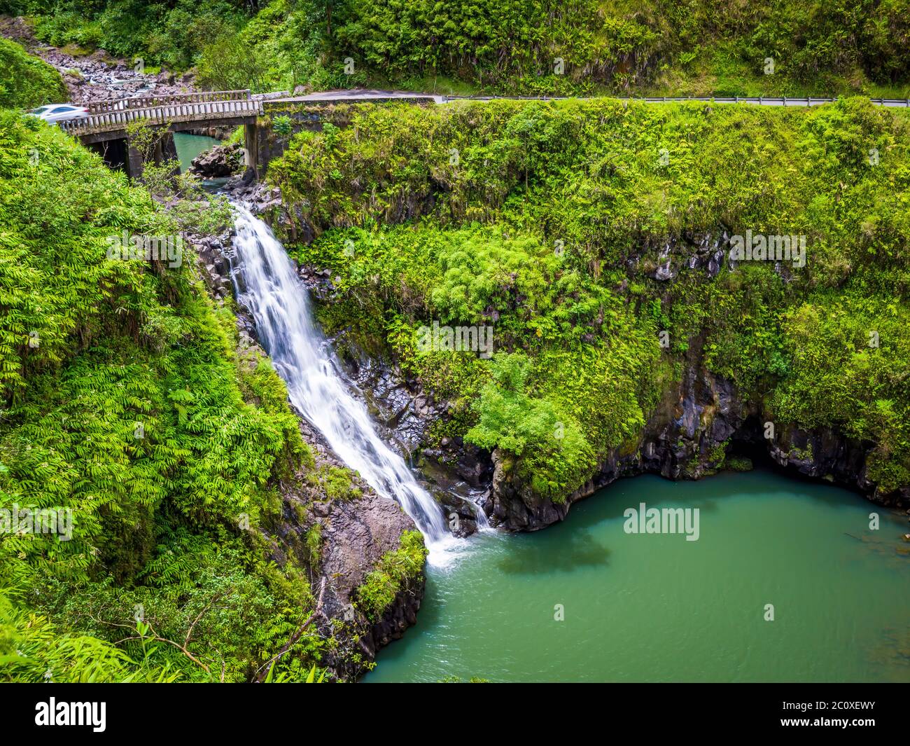 Maui, Hawaii Hana Highway - Wailua Iki Falls (Wailuaiki). Road to Hana connects Kahului to the town of Hana Over 59 bridges, 620 curves, tropical rain Stock Photo