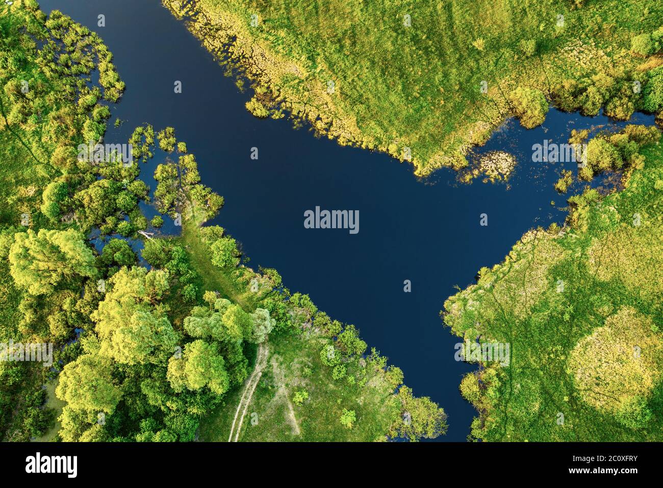 Aerial landscape of blue lake in green field, top view of beautiful ...