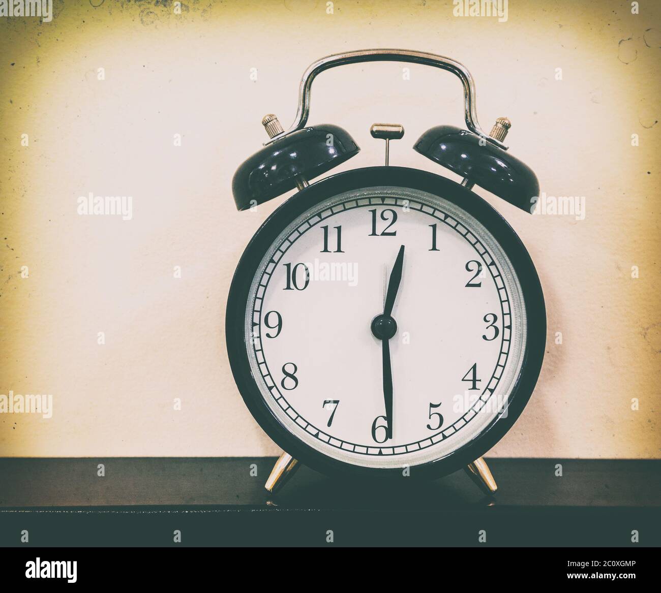 retro alarm clock on table Stock Photo