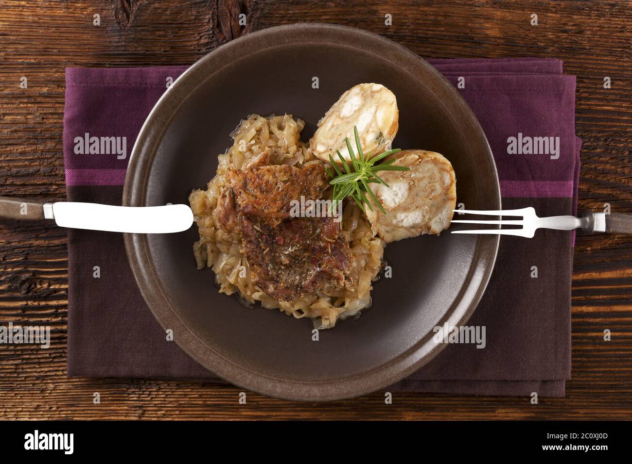 Baked pork chop with dumplings and sauerkraut Stock Photo Alamy
