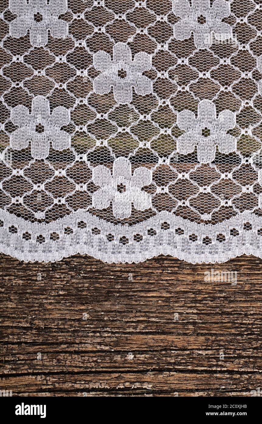 Openwork lace on wooden background Stock Photo