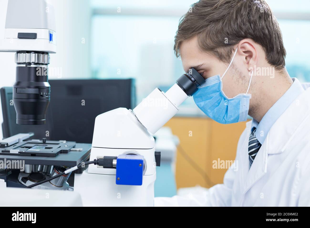 young man does medical experiment in lab Stock Photo