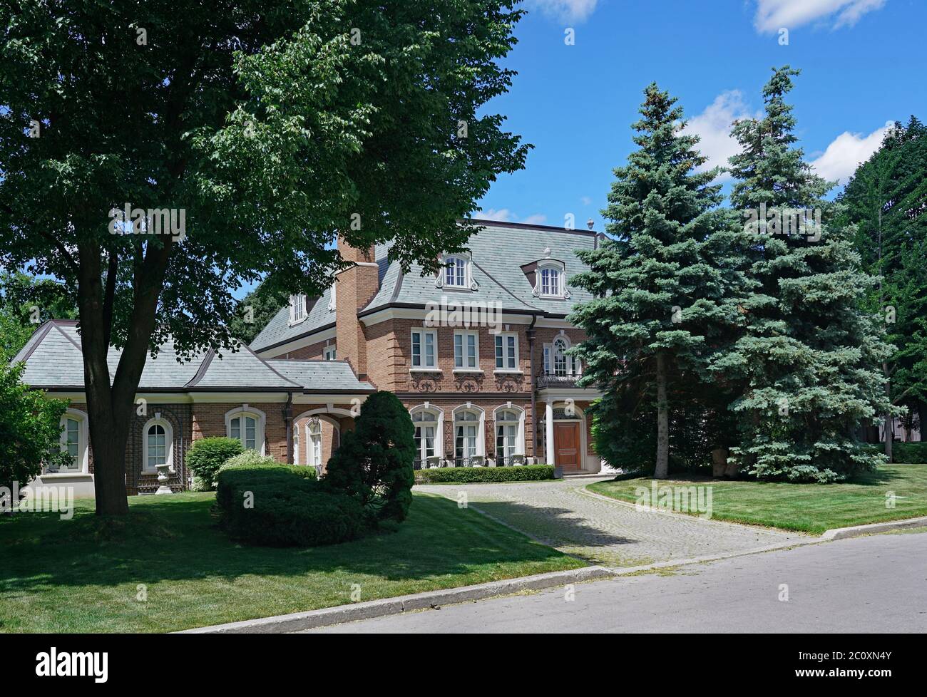 Toronto, Canada - June 12, 2020:  The Forest Hill area of Toronto has large houses on attractively landscaped lots. Stock Photo