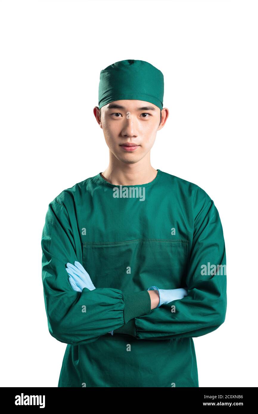 isolated asian young man doctor in green on white background Stock Photo