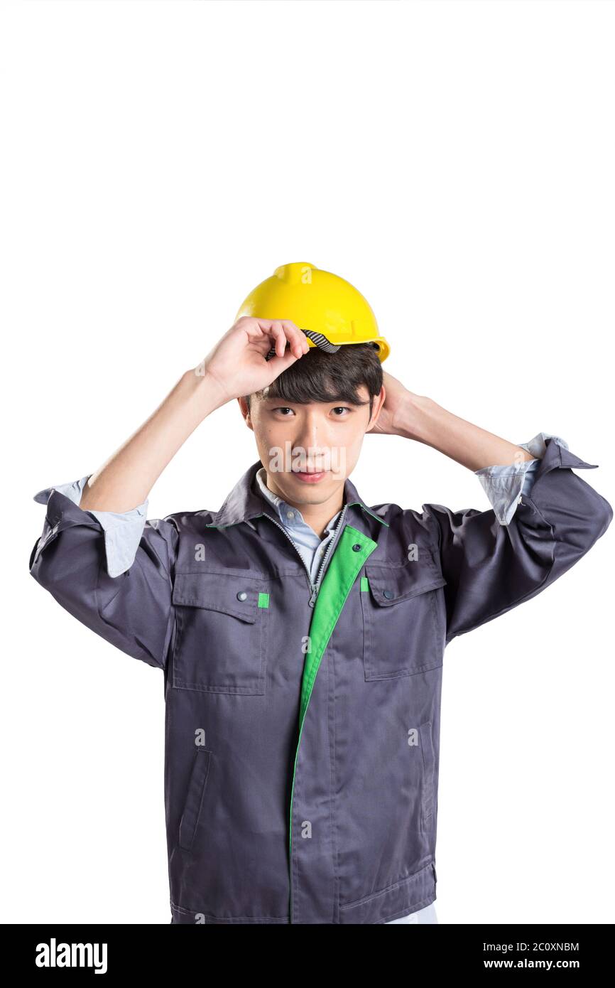 isolated young handsome asian technician on white background Stock Photo