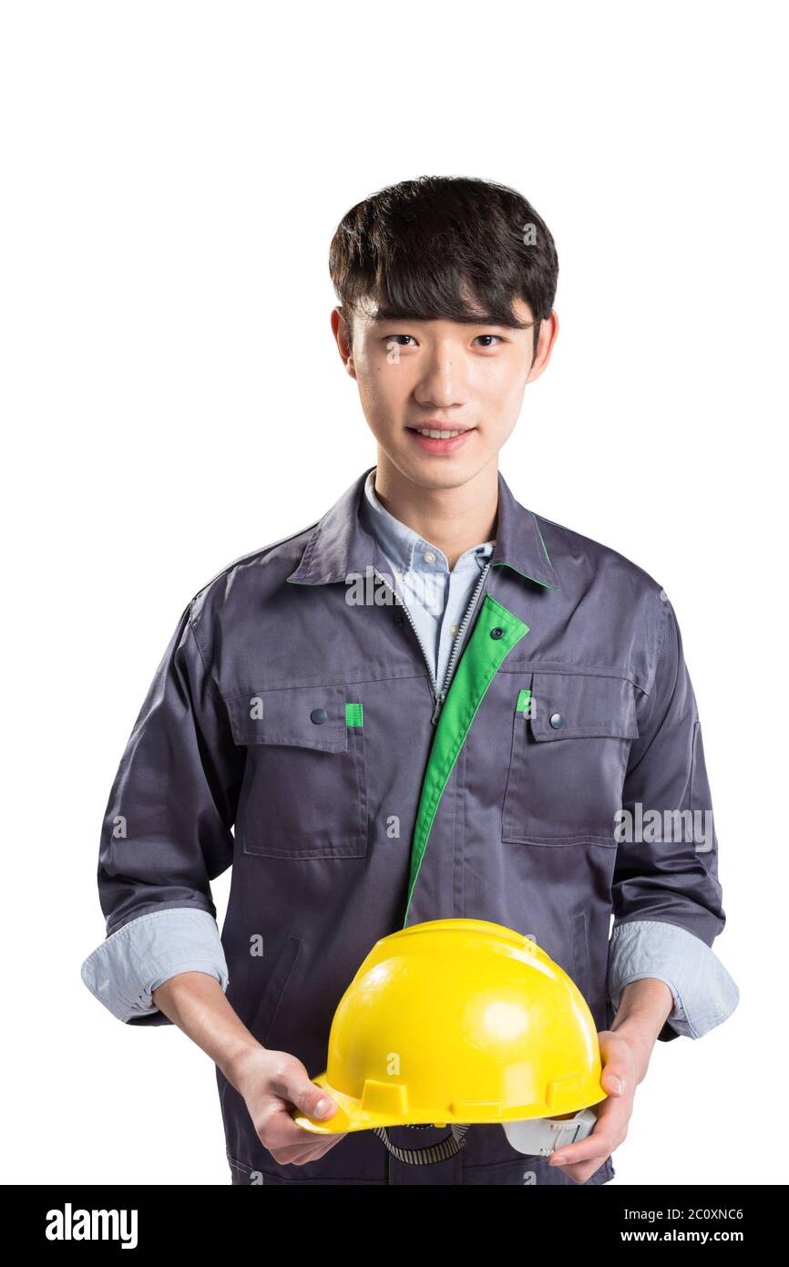 isolated young handsome asian technician on white background Stock Photo