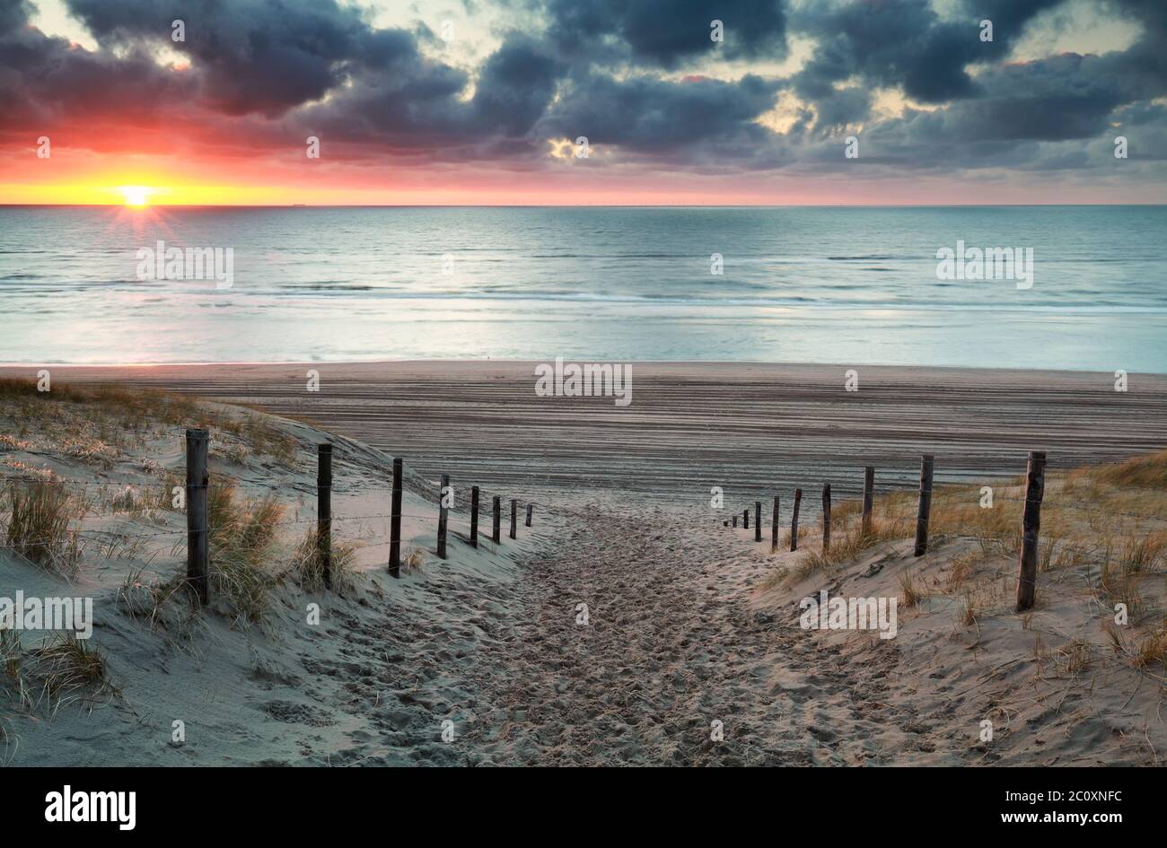 sand path to North sea beach at sunset Stock Photo - Alamy