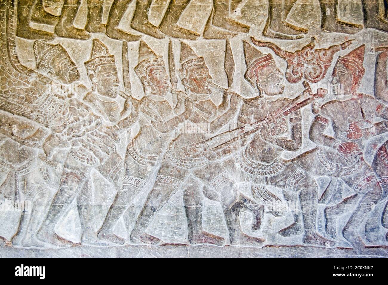 Khmer bas relief carving of an army band marching into battle. Frieze on Northern gallery, Angkor Wat Temple, Siem Reap, Cambodia. Stock Photo