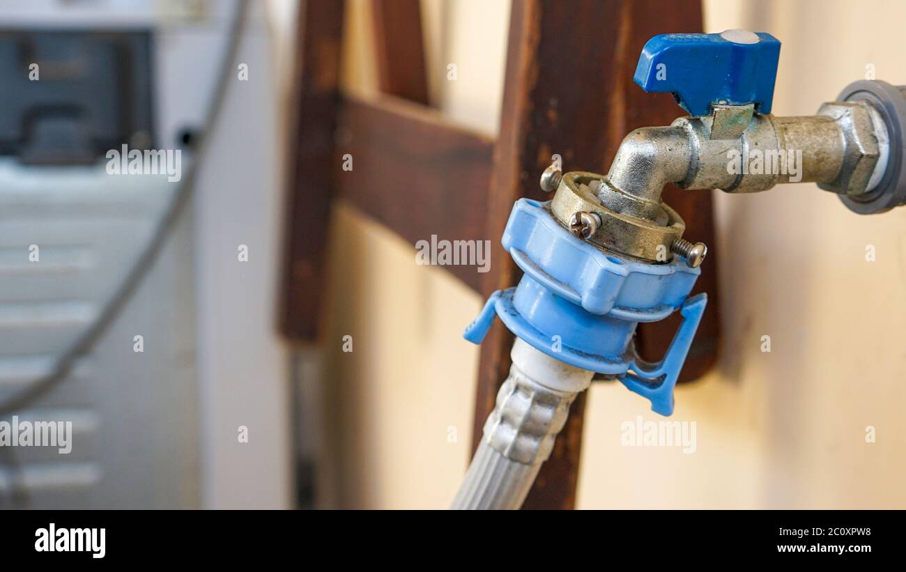 Close up the water tap for the washing machine Stock Photo - Alamy