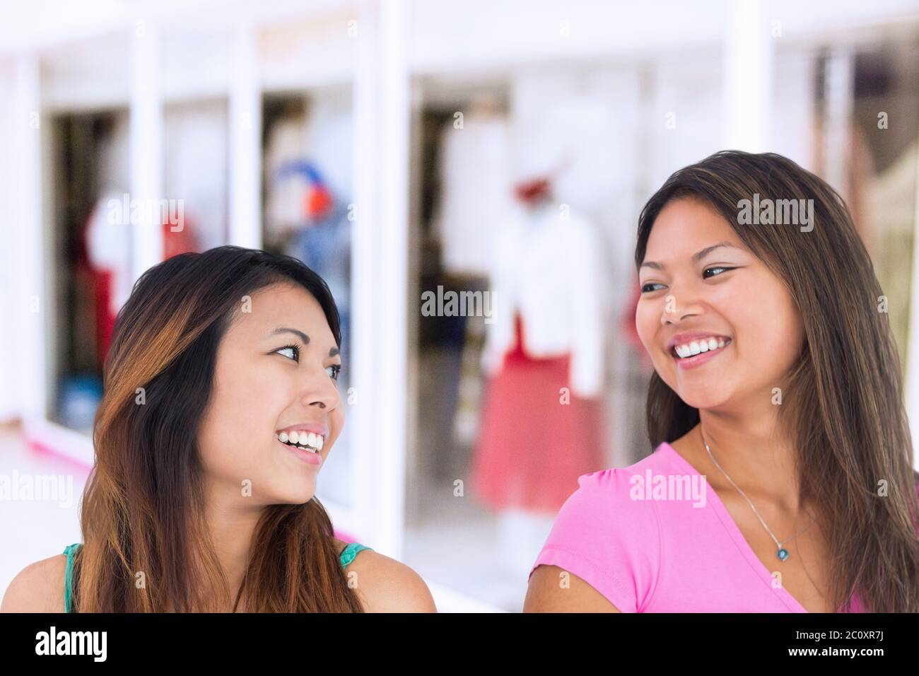 Two women facing camera hi-res stock photography and images - Alamy