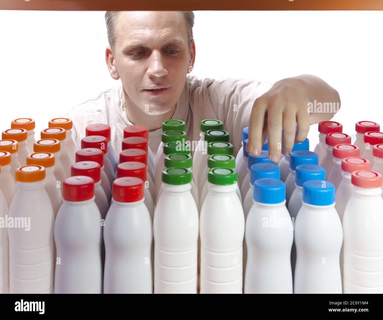 The man selects dairy products in the shop Stock Photo Alamy