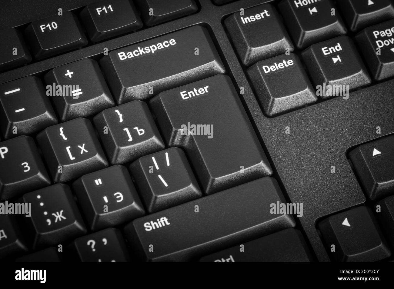 Electronic collection - black computer keyboard. The focus on the Enter key. Stock Photo