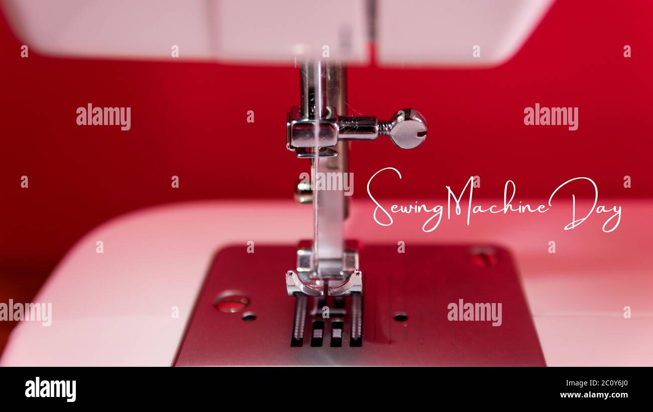 Close up photo of white sewing machine. Detail of the needle, plate