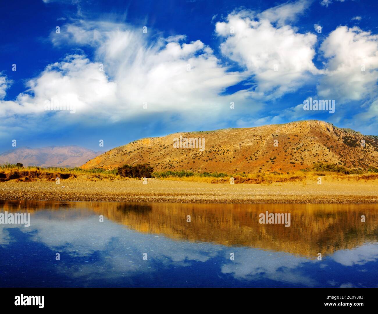 Reflection in water of mountain lakes. Stock Photo