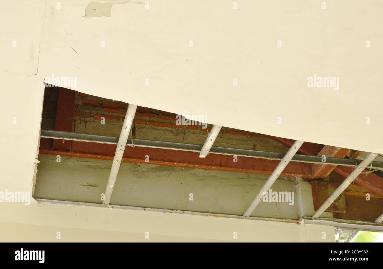 broken and damage home ceiling falling down to ground Stock Photo Alamy