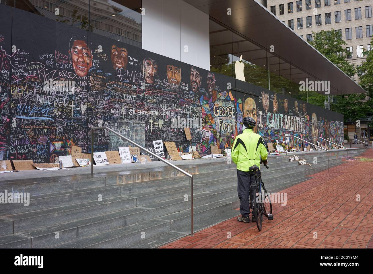 The boarded-up Apple Store in downtown Portland's Pioneer Place, which has become unofficial canvases for peaceful protest, seen on Friday, 6/12/2020. Stock Photo