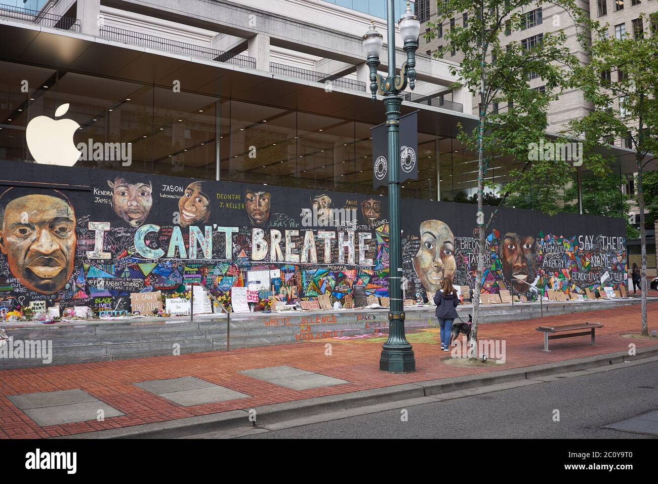 The boarded-up Apple Store in downtown Portland's Pioneer Place, which has become unofficial canvases for peaceful protest, seen on Friday, 6/12/2020. Stock Photo