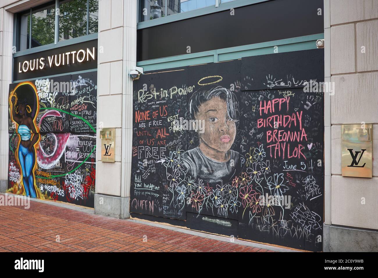 The boarded-up Louis Vuitton store in Pioneer Place in downtown Portland, Oregon, which has become canvases for protest, seen on Friday, Jun 12, 2020. Stock Photo