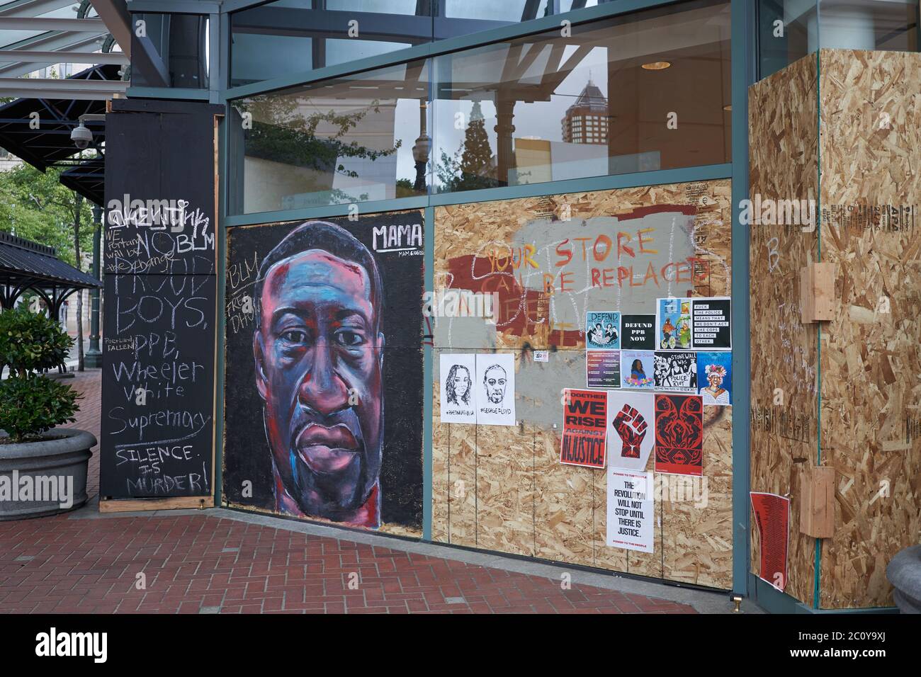 The boarded-up Pioneer Place in downtown Portland, Oregon, which has become canvases for protest, seen on Friday, Jun 12, 2020. Stock Photo