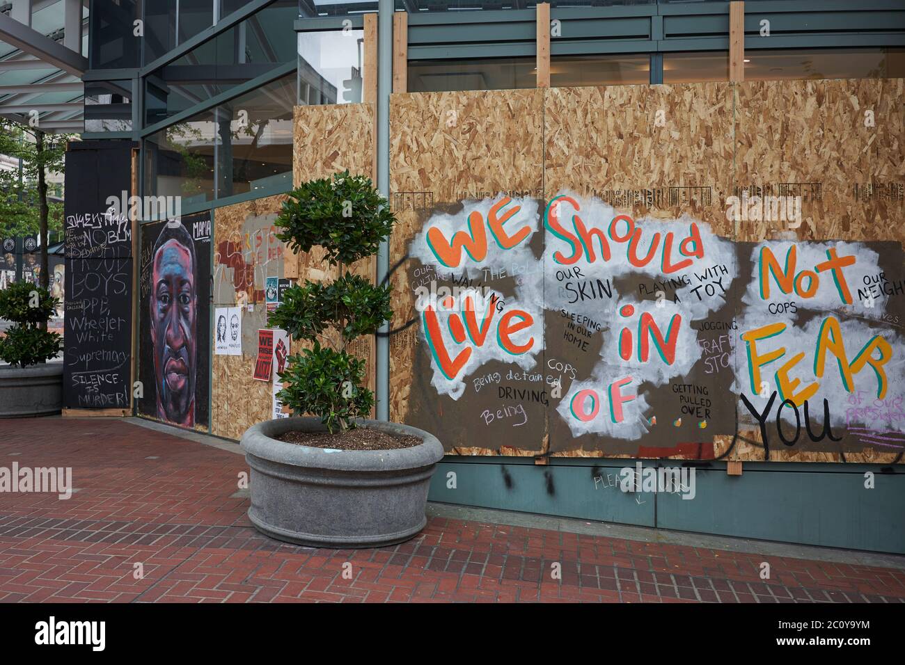 The boarded-up Pioneer Place in downtown Portland, Oregon, which has become canvases for protest, seen on Friday, Jun 12, 2020. Stock Photo