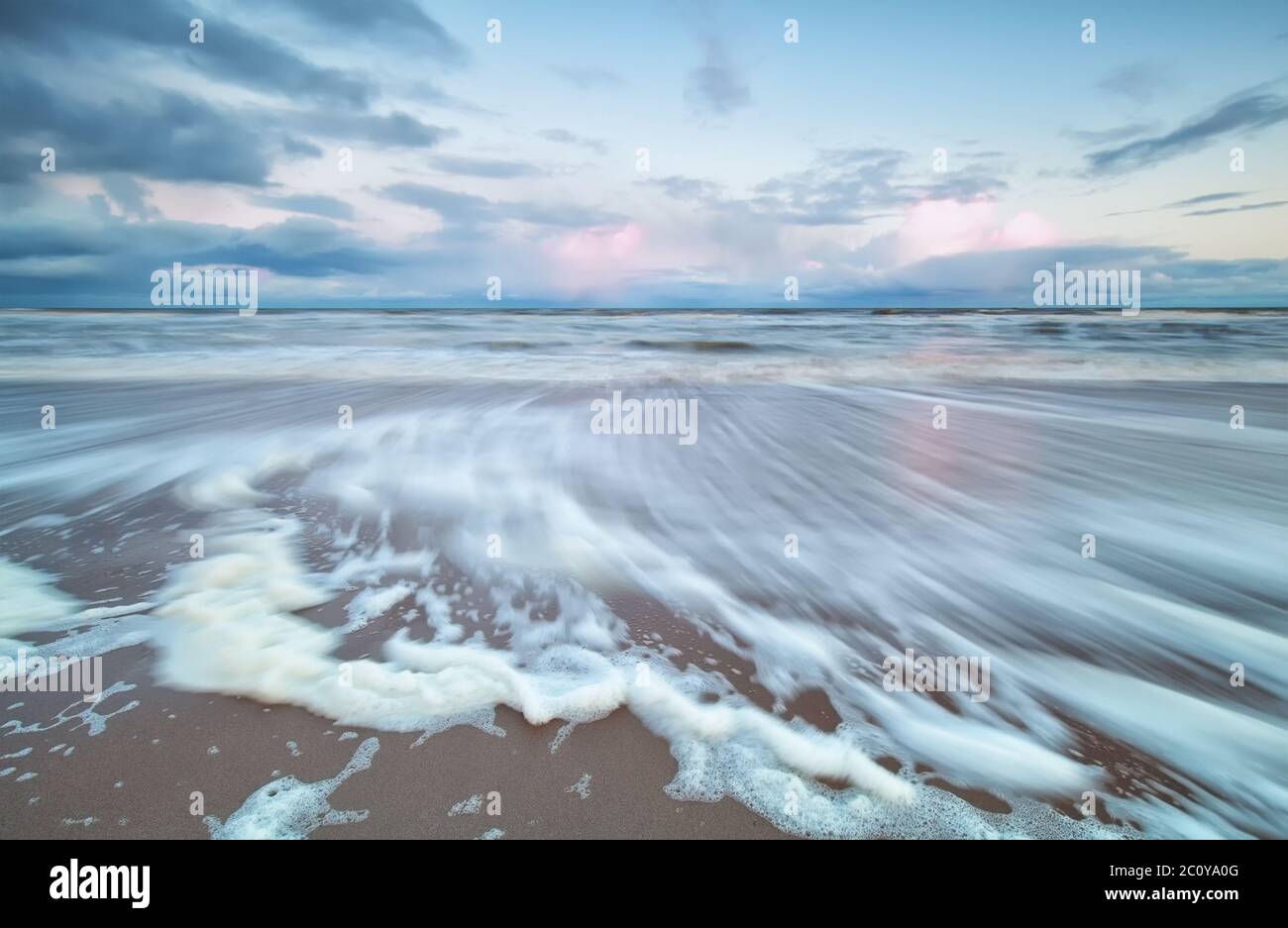 blurred North sea wave at sunrise Stock Photo