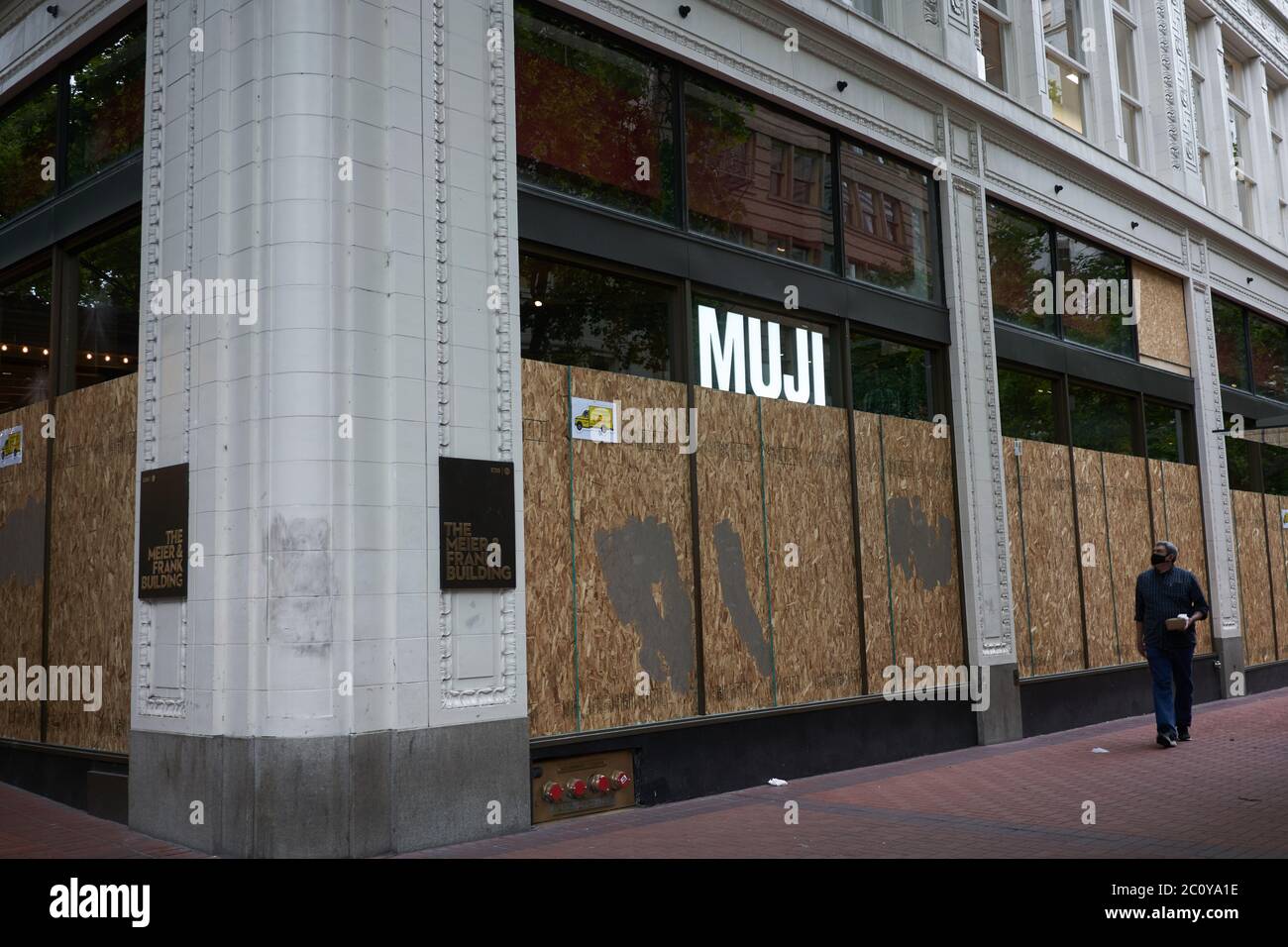 The MUJI store in downtown Portland, Oregon, is seen boarded up to protect from further damage amid the protest, on Friday, Jun 12, 2020. Stock Photo