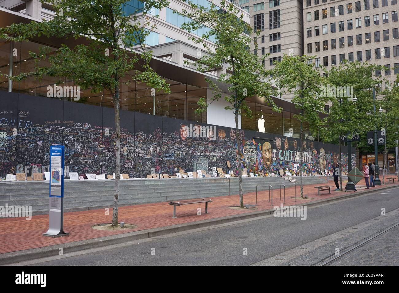 The boarded-up Apple Store in downtown Portland's Pioneer Place, which has become unofficial canvases for peaceful protest, seen on Friday, 6/12/2020. Stock Photo