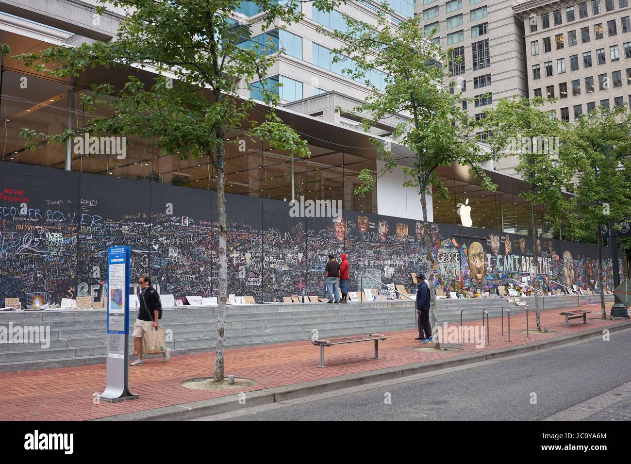 The boarded-up Apple Store in downtown Portland's Pioneer Place, which has become unofficial canvases for peaceful protest, seen on Friday, 6/12/2020. Stock Photo
