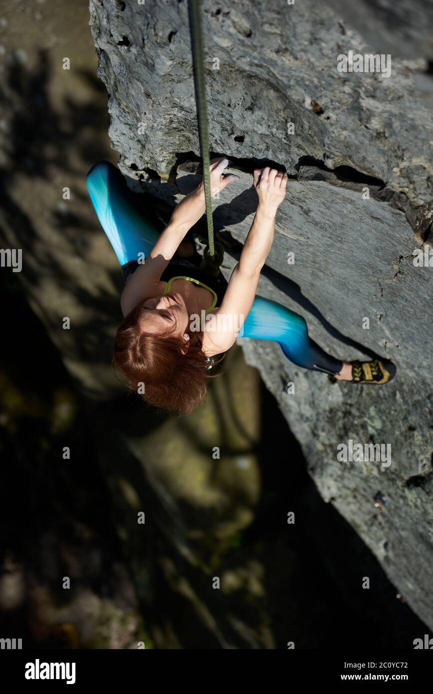 Young girl wearing climbing harness hires stock photography and images