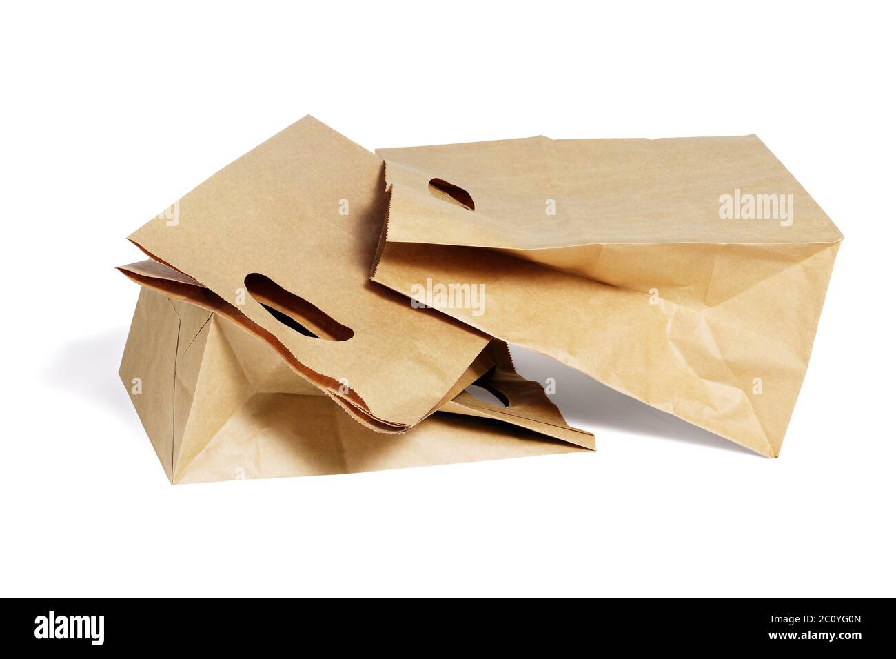 Three Brown Paper Bags Lying on White Background Stock Photo
