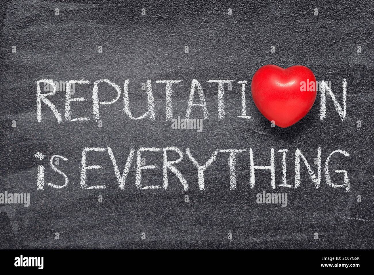 reputation is everything phrase written on chalkboard with red heart symbol Stock Photo
