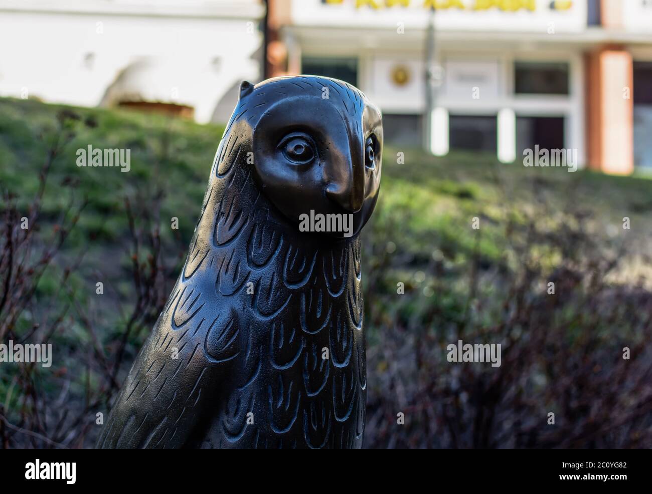 Head of bronze owl sculpture at the Old Town's Doma Square playground Stock Photo