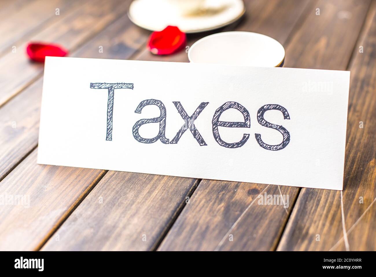 taxes on white paper Stock Photo Alamy