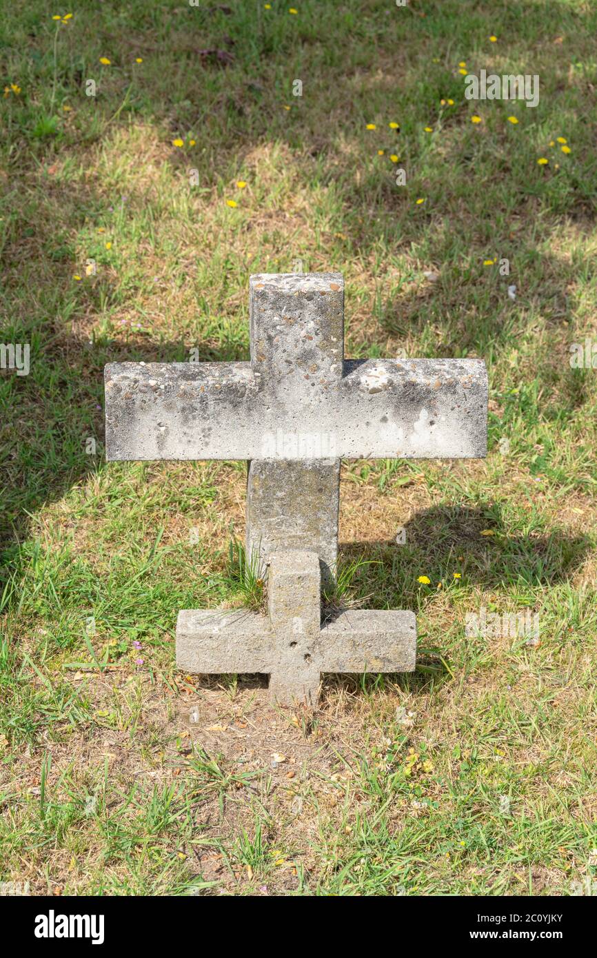 Large and small concrete cross in the grass Stock Photo