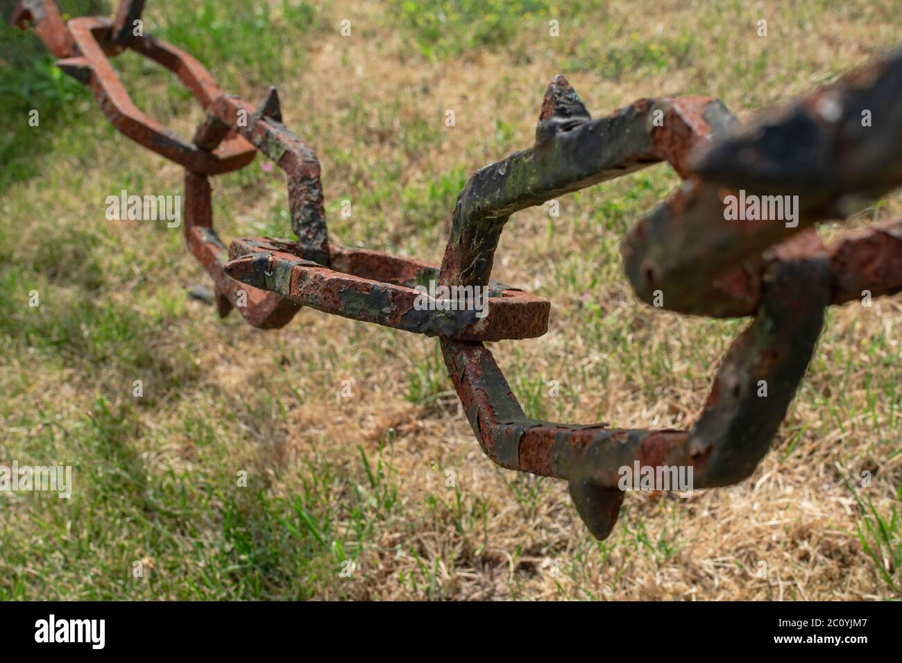Large rusted link of a heavy chain Stock Photo