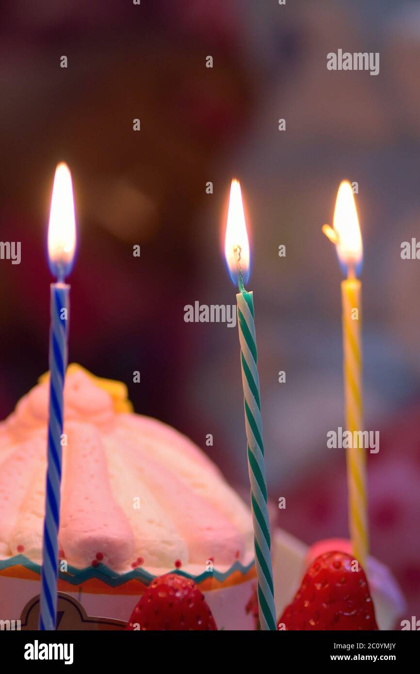Background Birthday Cake with burning candles Stock Photo - Alamy