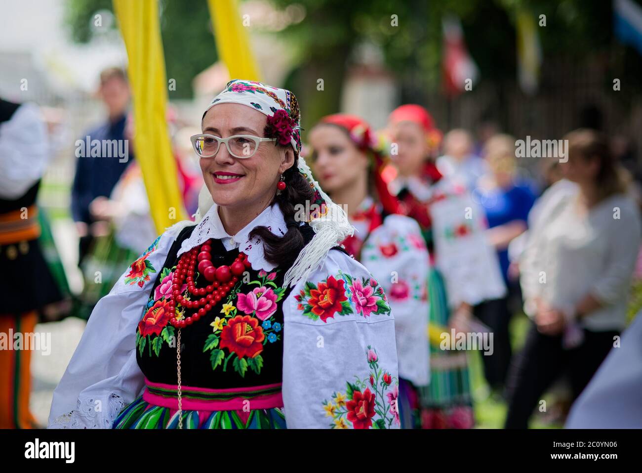 Lowicz, Poland - June 11 2020: An unidentified polish woman wearing traditional folk Lowicz national costume while joins Corpus Christi procession, po Stock Photo