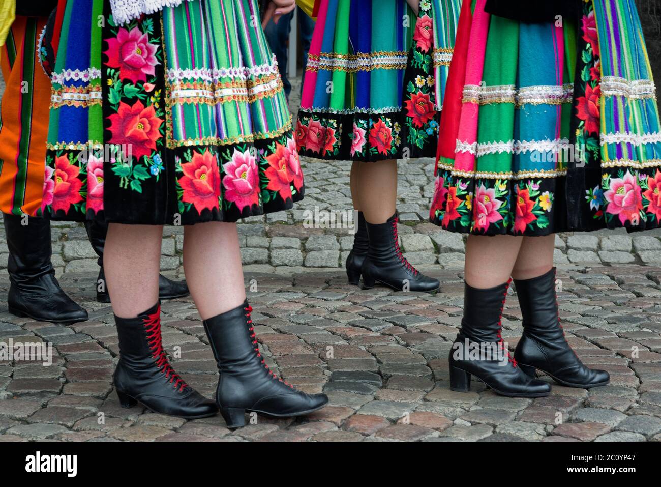 Women And Young Girls Wearing Regional Folk Costumes From Lowicz Region In Poland During Annual