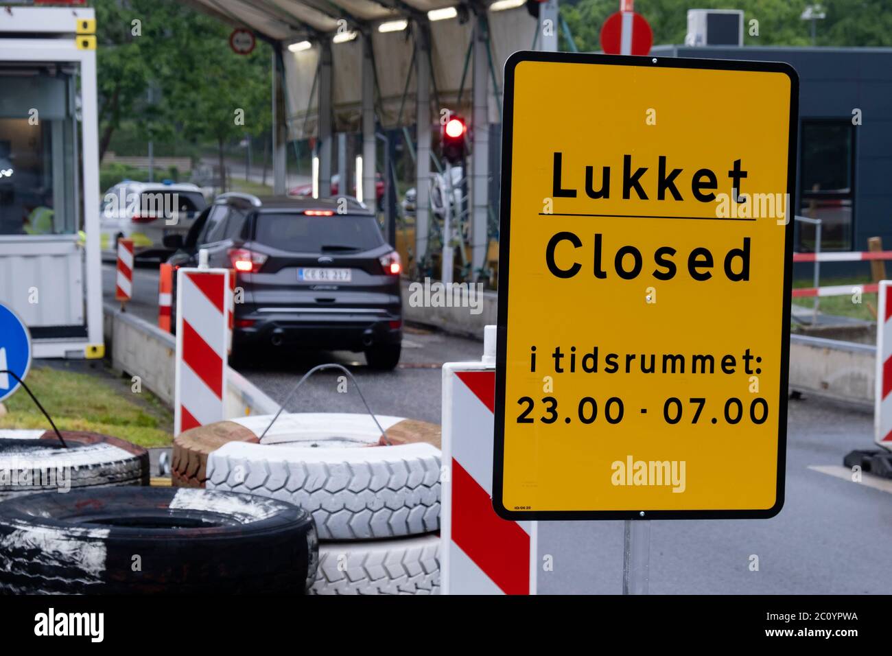 Harrislee, Germany. 13th June, 2020. There is a sign at the border crossing  to Denmark in Padborg indicating the opening hours. This was opened on  Saturday morning in order to relieve the