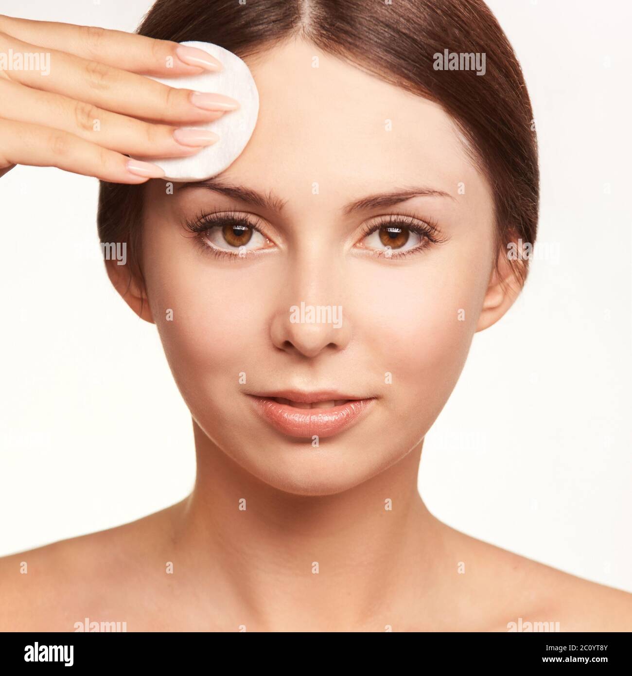 Home face care. Girl remove makeup. Woman hand with pad. Skin clean