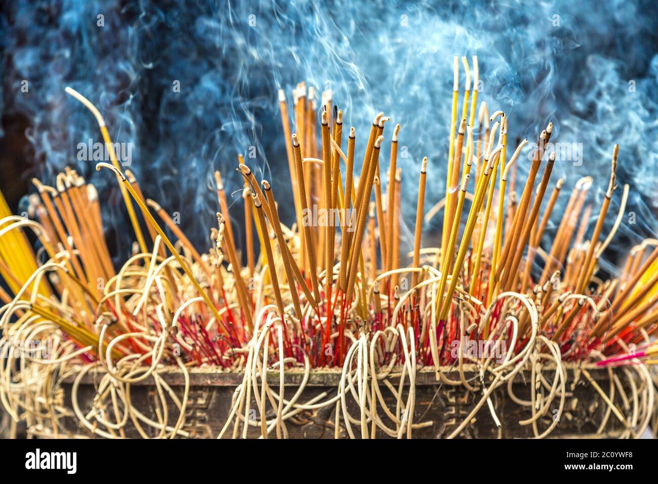 Burning incense sticks in Tran Quoc pagoda in Hanoi, Vietnam in a