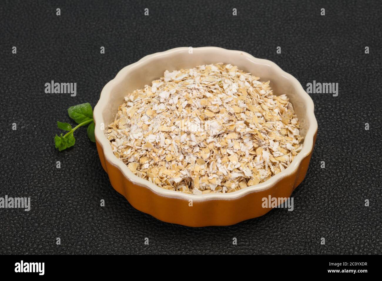 Raw oats in the bowl for breakfast Stock Photo Alamy