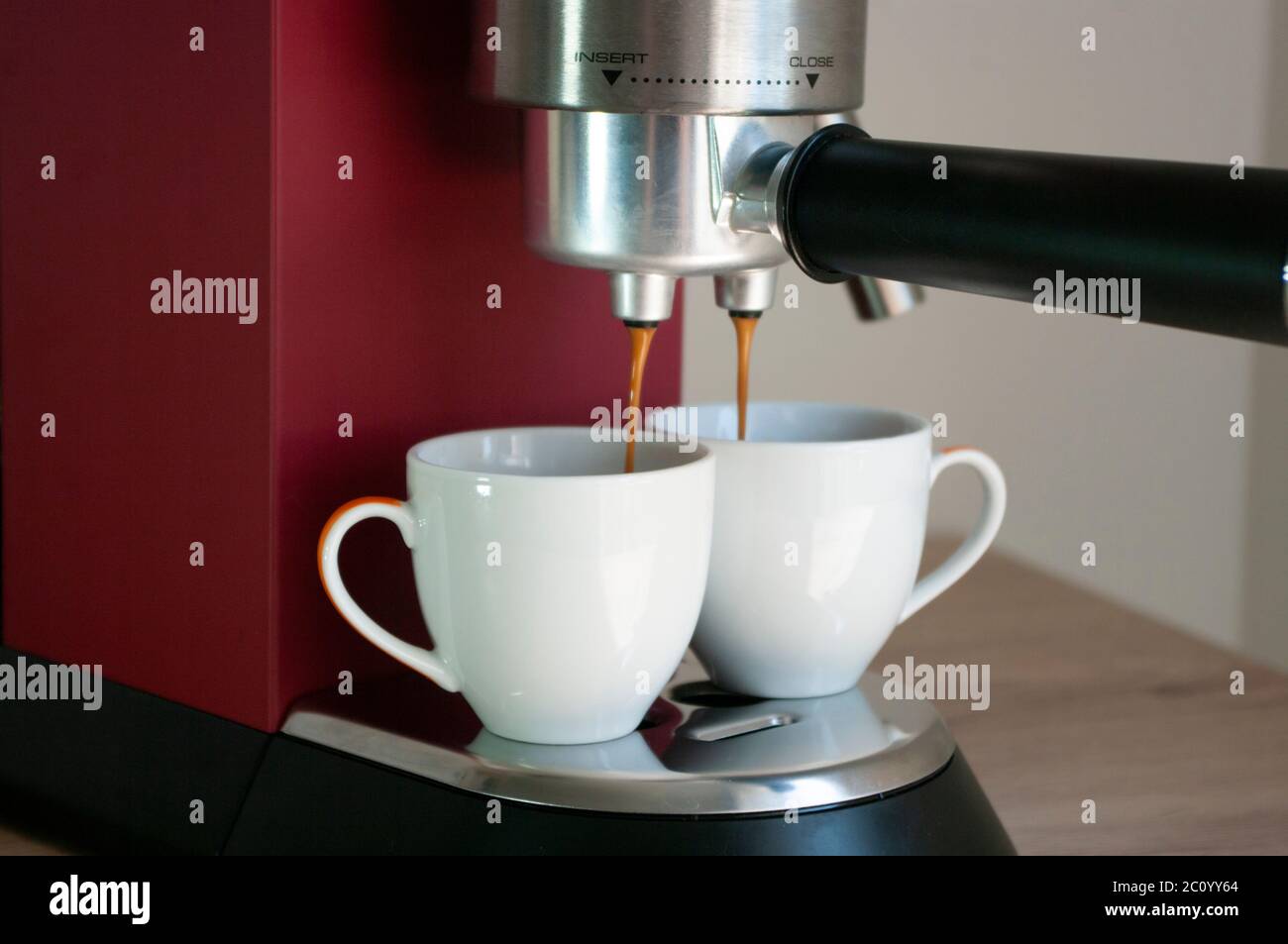 https://c8.alamy.com/comp/2C0YY64/red-coffee-machine-and-two-cups-mockup-espresso-make-2C0YY64.jpg