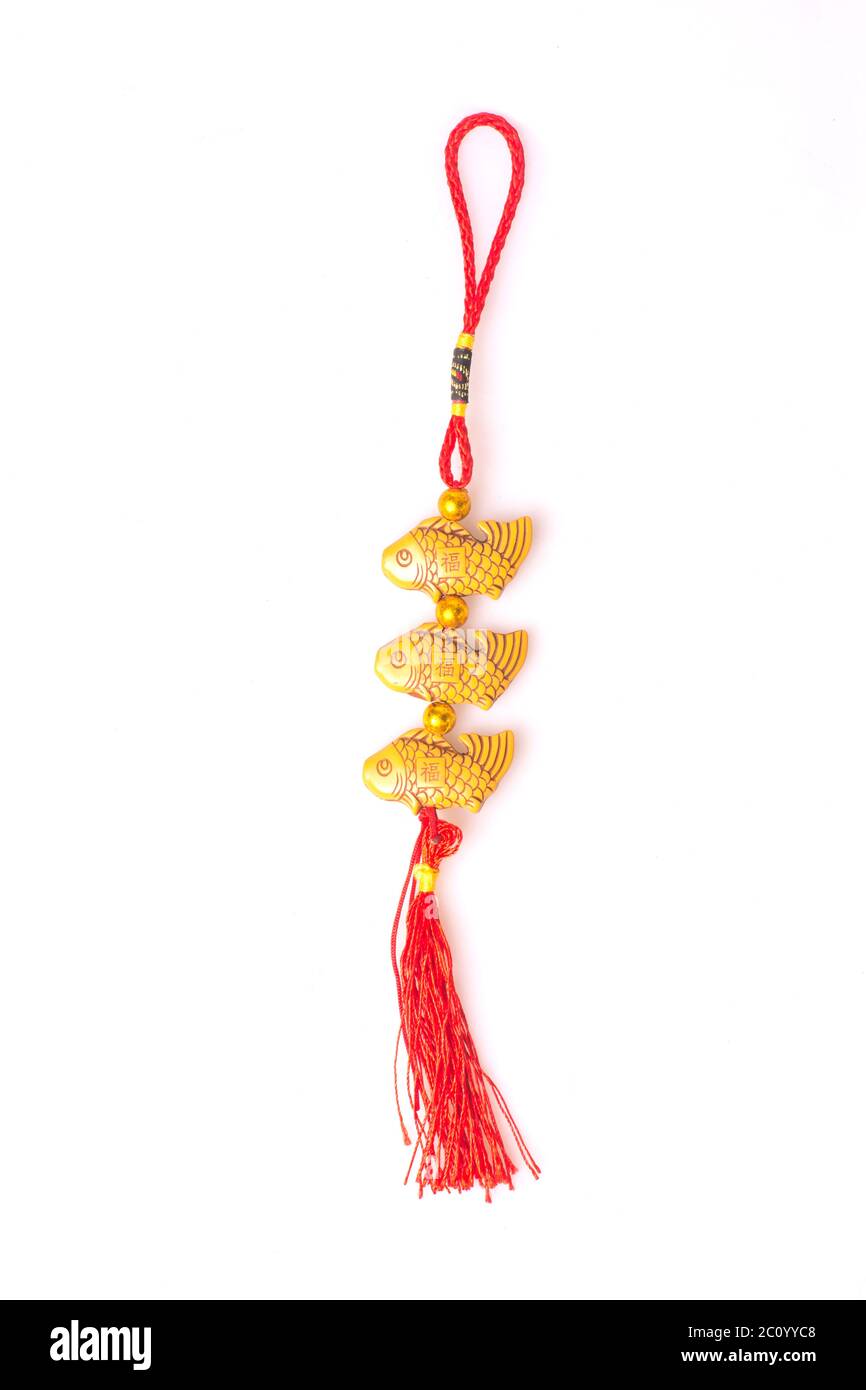 beautiful decor with gold fish and red rope Stock Photo - Alamy