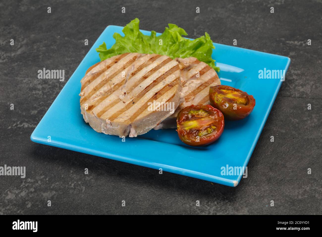 Grilled tuna steak with kumato and salad Stock Photo Alamy