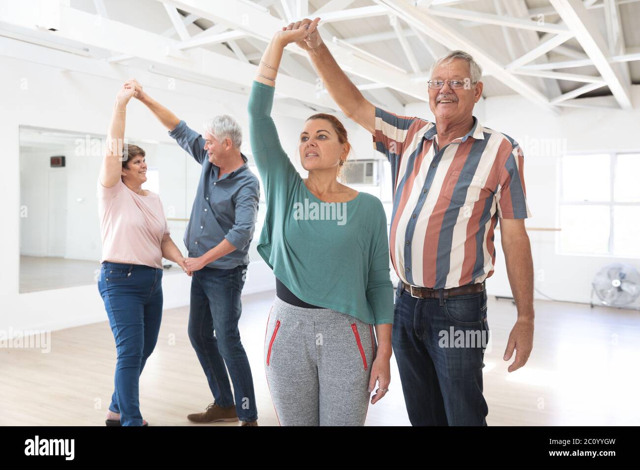Caucasian senior couples ballroom dancing Stock Photo