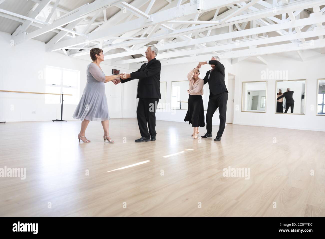 Caucasian senior couples ballroom dancing Stock Photo