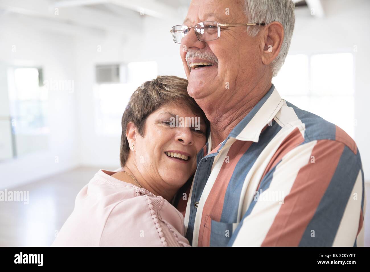 Happy Caucasian senior couple during ballroom dancing session Stock Photo