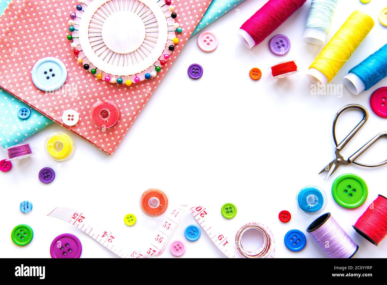 Sewing accessories and fabric on a white background. Sewing threads ...
