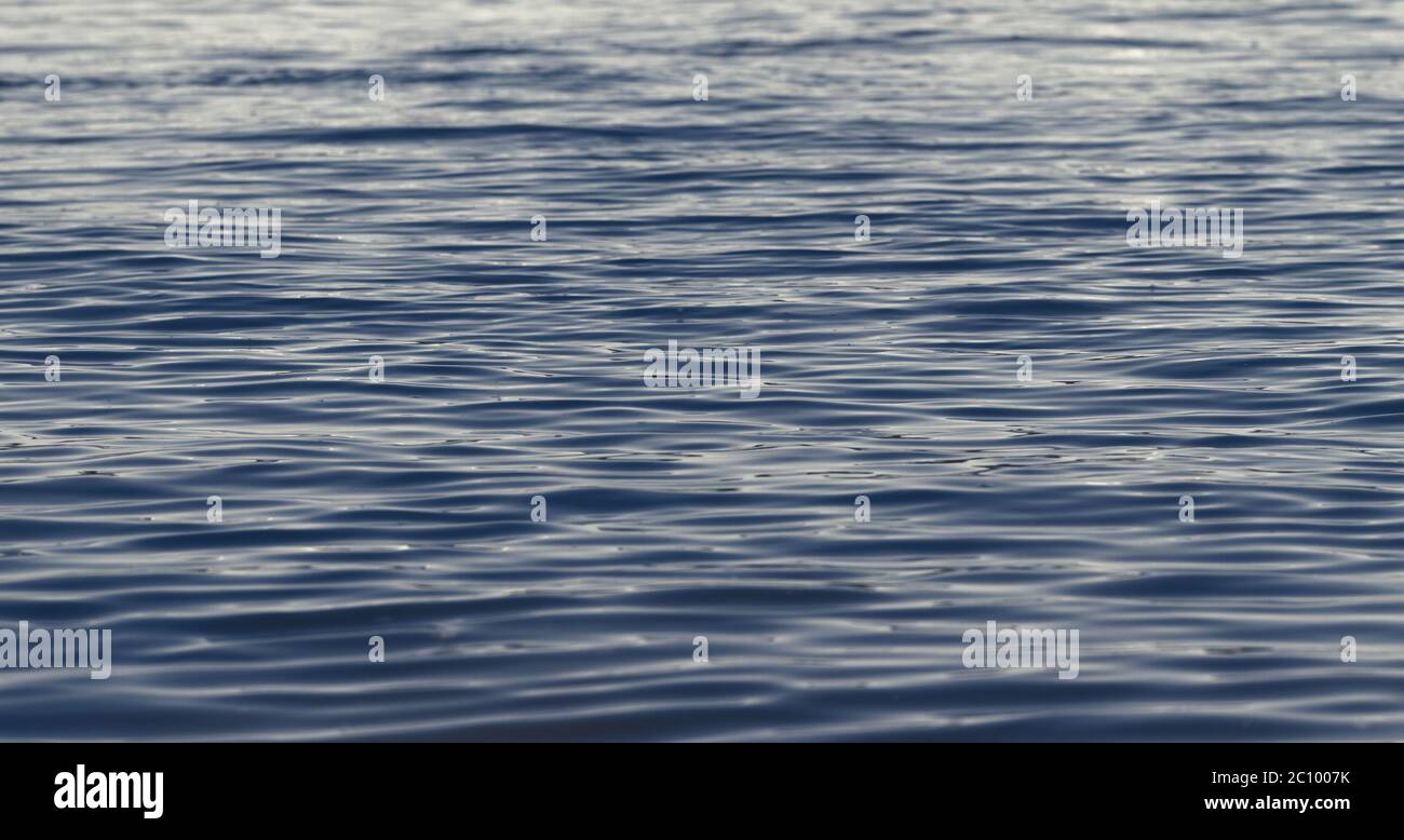 Photo of blue water background with ripples Stock Photo - Alamy
